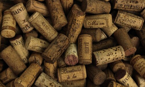 A bunch of wine corks mainly from the Bordeaux region