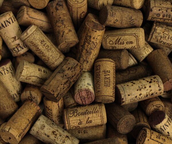 A bunch of wine corks mainly from the Bordeaux region
