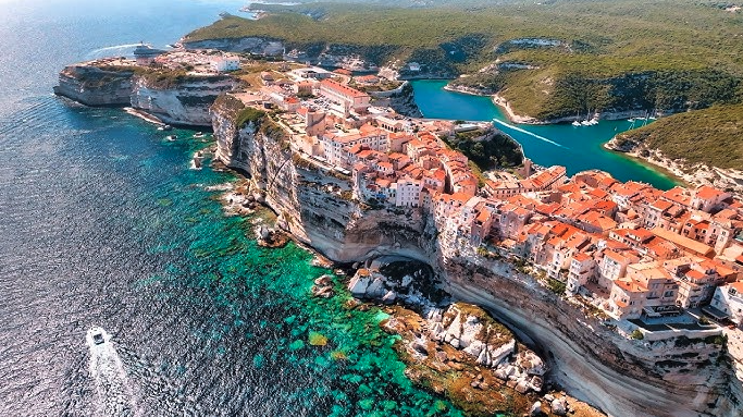 Breathtaking landscapes of Corsica, where rugged mountains meet the crystal-clear Mediterranean Sea