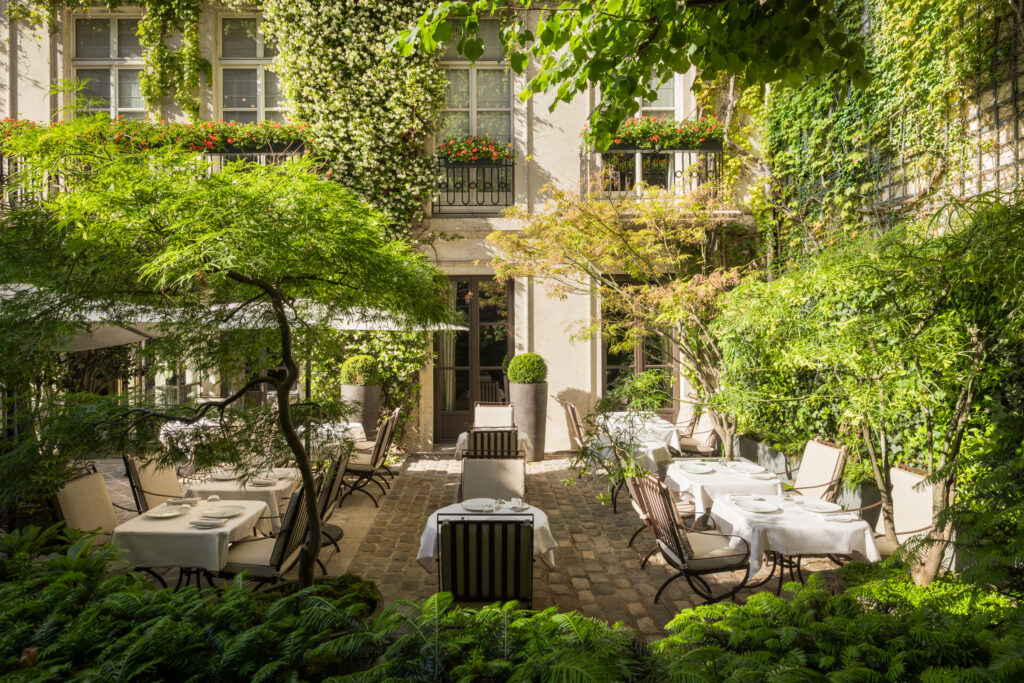 A secret Parisian retreat hidden behind elegant façades, where beautiful gardens and timeless luxury remain known only to a few.