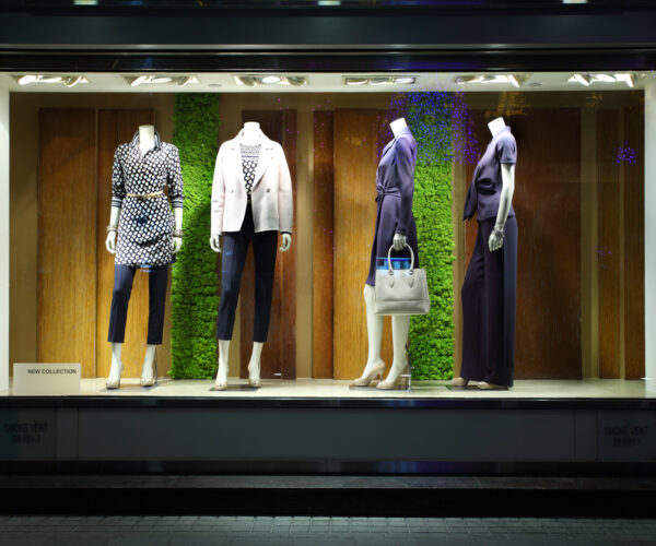 Emerging fashion designer showcasing contemporary designs inspired by Parisian style and luxury craftsmanship.